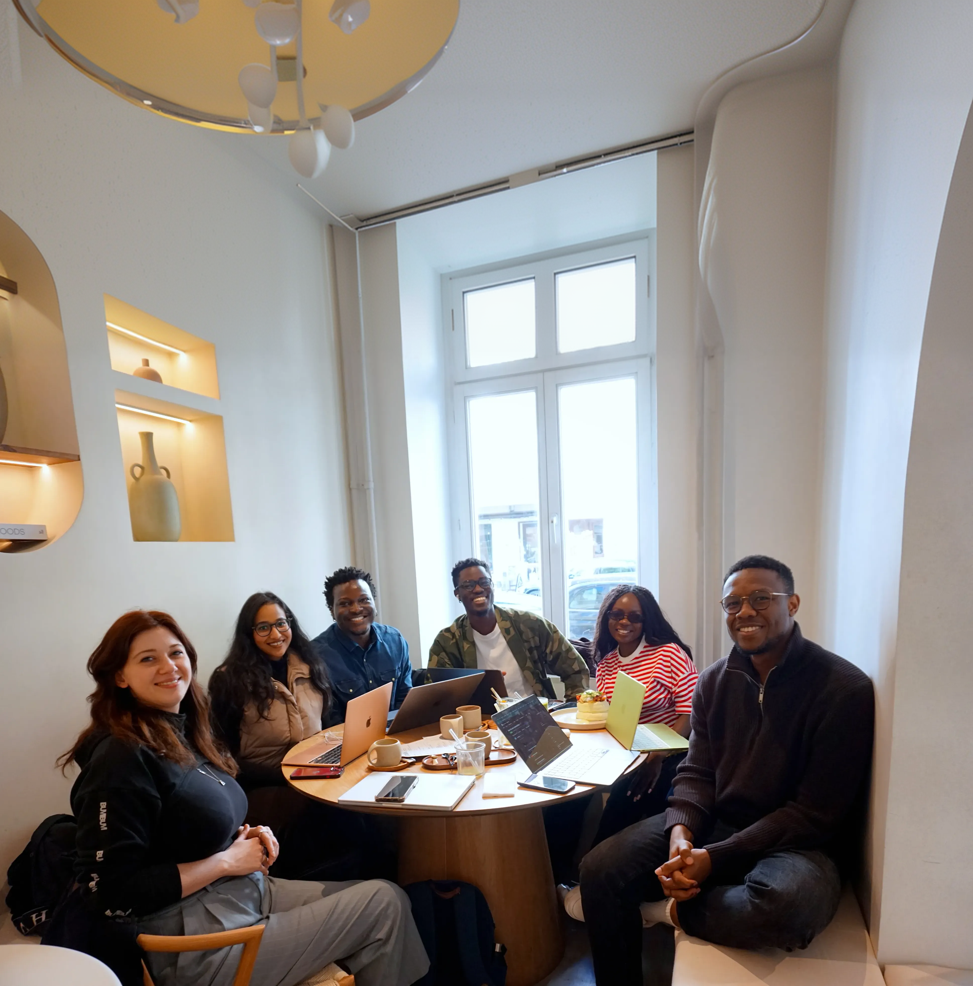 The WANDARER Berlin edition participants smiling around a table